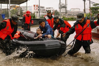 In Beijing, more than 52,000 people were evacuated due to heavy rains